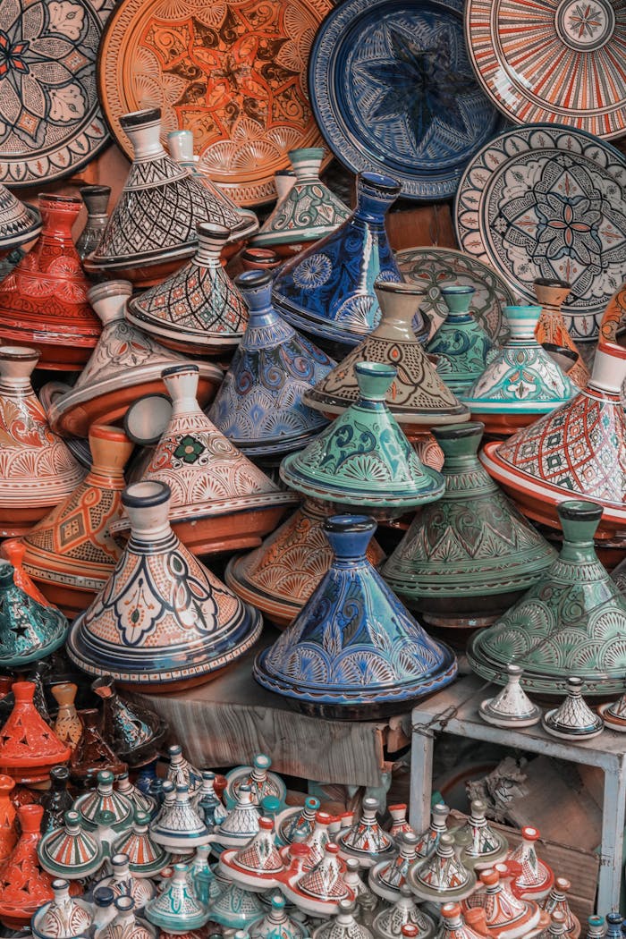Colorful Moroccan tagine pots artfully stacked, showcasing traditional craftsmanship.